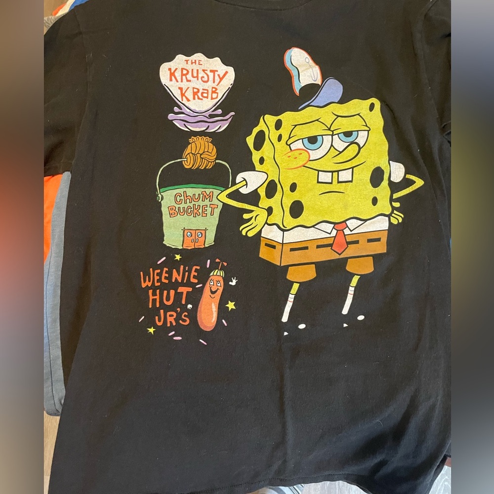 in great condition, all black on the back of the shirt, selling for $5